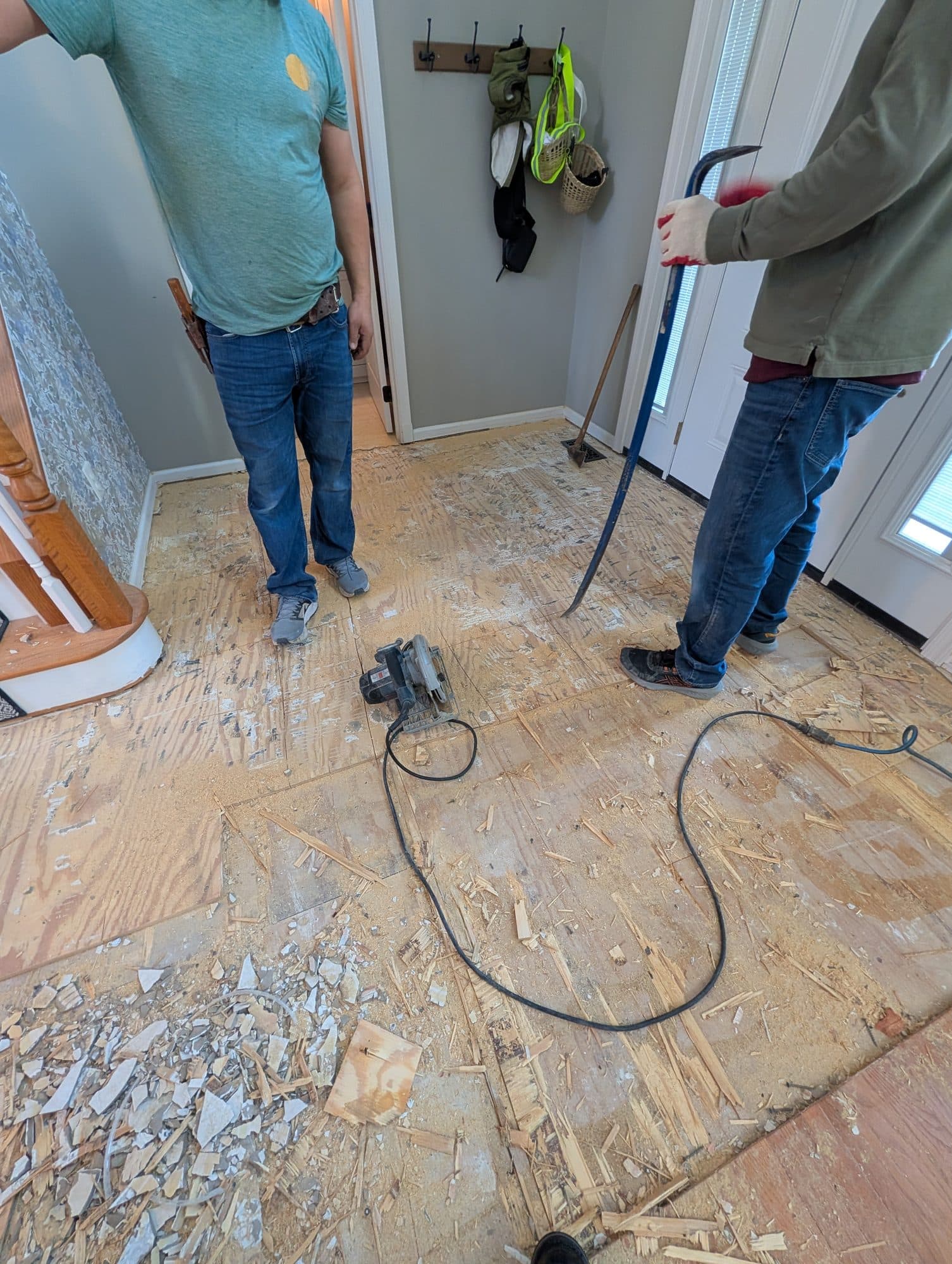 Flooring crew removing old flooring down to the subfloor
